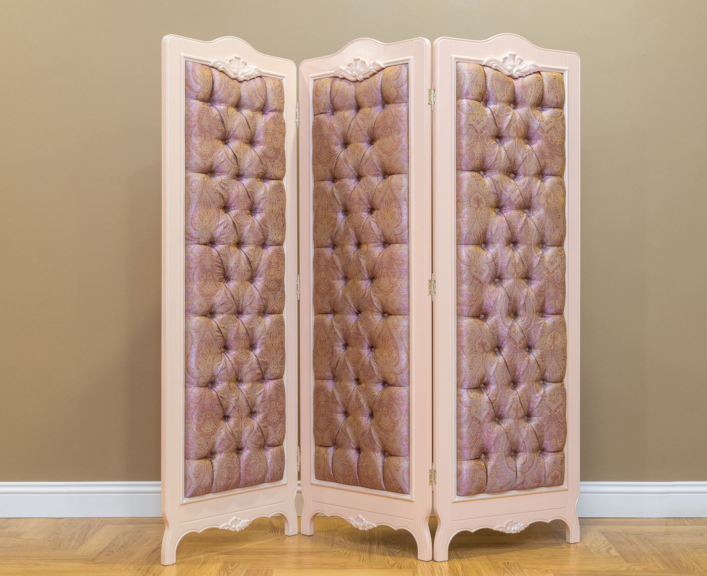 A three-panel upholstered freestanding screen
