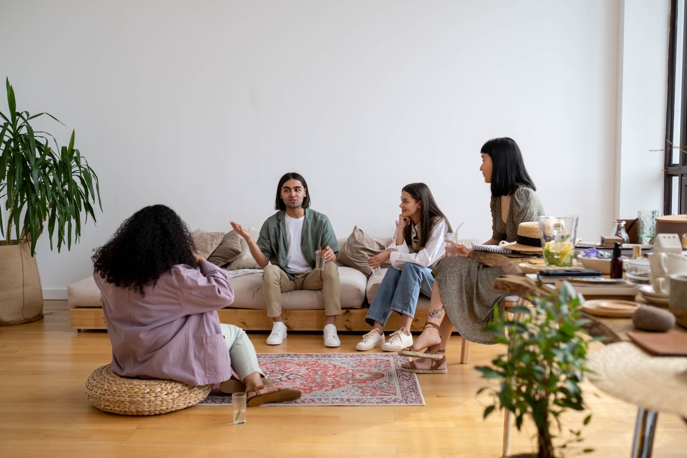 Friends seated together in a relaxed home gathering