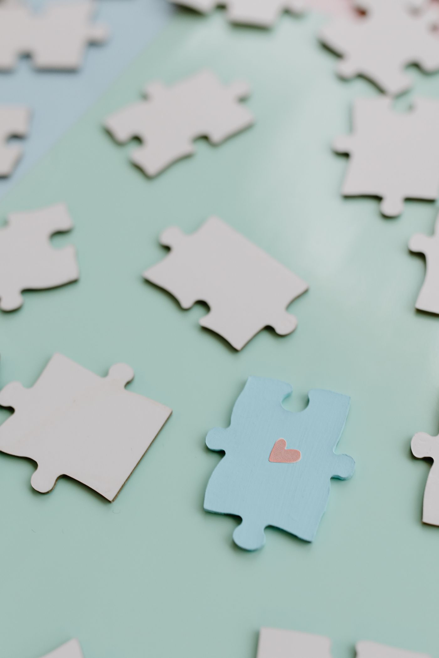 Loose jigsaw pieces scattered across a pale surface