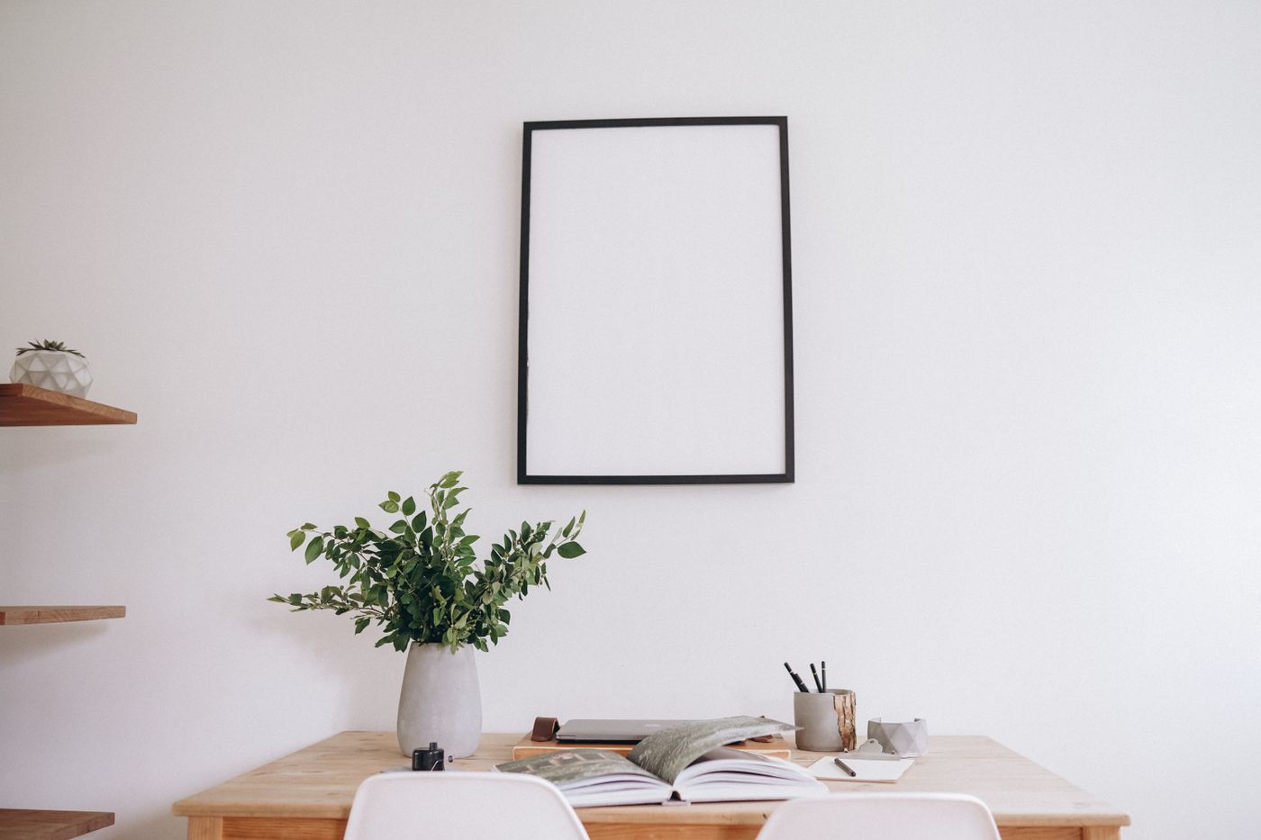 Desk beneath a conventional wall-mounted frame