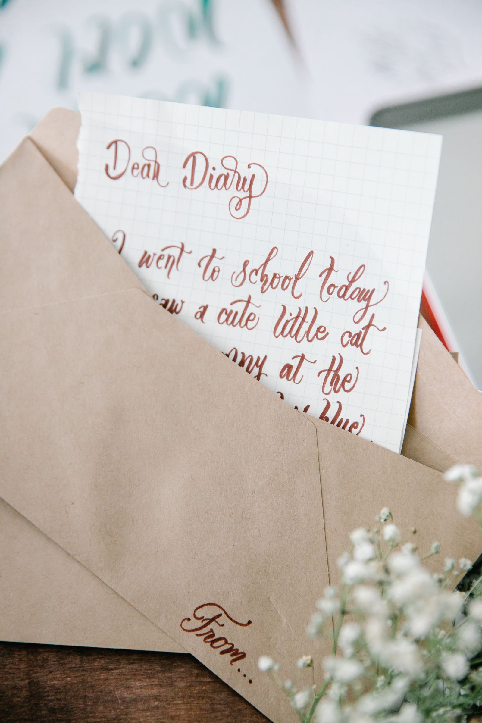 A handwritten sheet inside a brown envelope