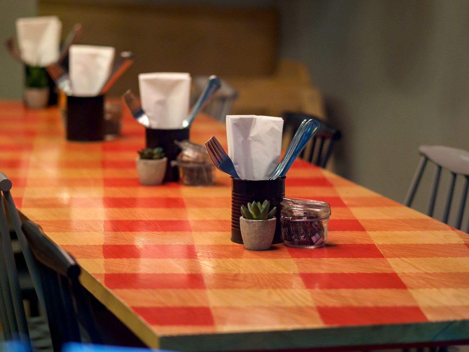 A checked tablecloth covering a restaurant table